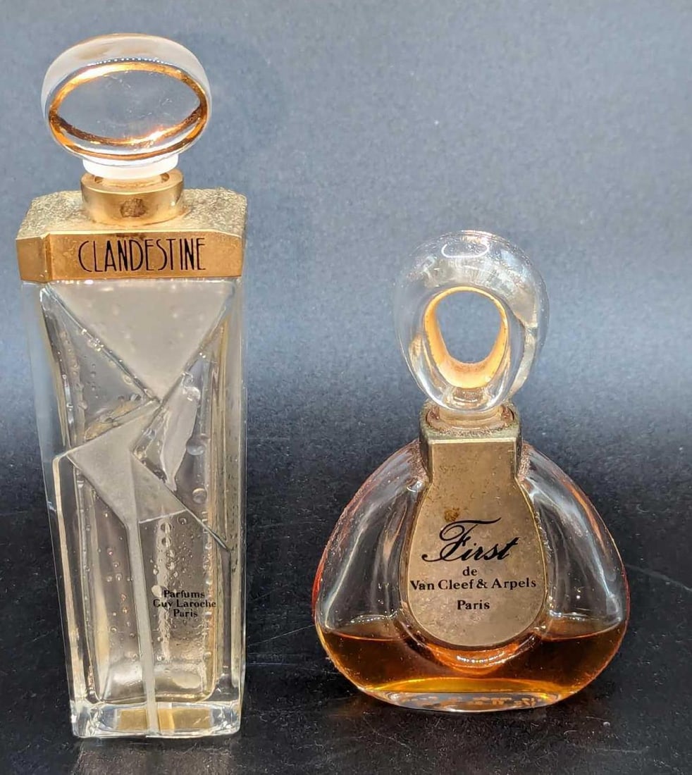 Guy Laroche Clandestine & FIRST de Van Cleef & Arpels Bottles: Guy Laroche Clandestine & FIRST de Van Cleef & Arpels Bottles. This lot includes: (1) Guy Laroche Clandestine Empty Glass Perfume Bottle. This is approx 1 1/4" x 1" x 4 3/4". 