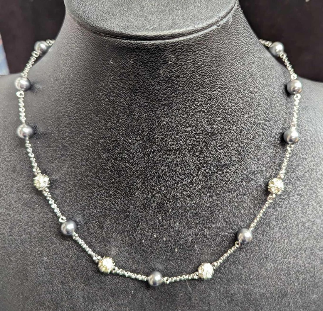 Nolan Miller Silvertone Gray Faux Pearl Rhinestone Necklace: Nolan Miller Silvertone Gray Faux Pearl Rhinestone Necklace. This is approx 19". It Comes in a Nolan Miller bag that is approx 3 1/4" x 1/4" x 4" and it weighs 0.04lb. 