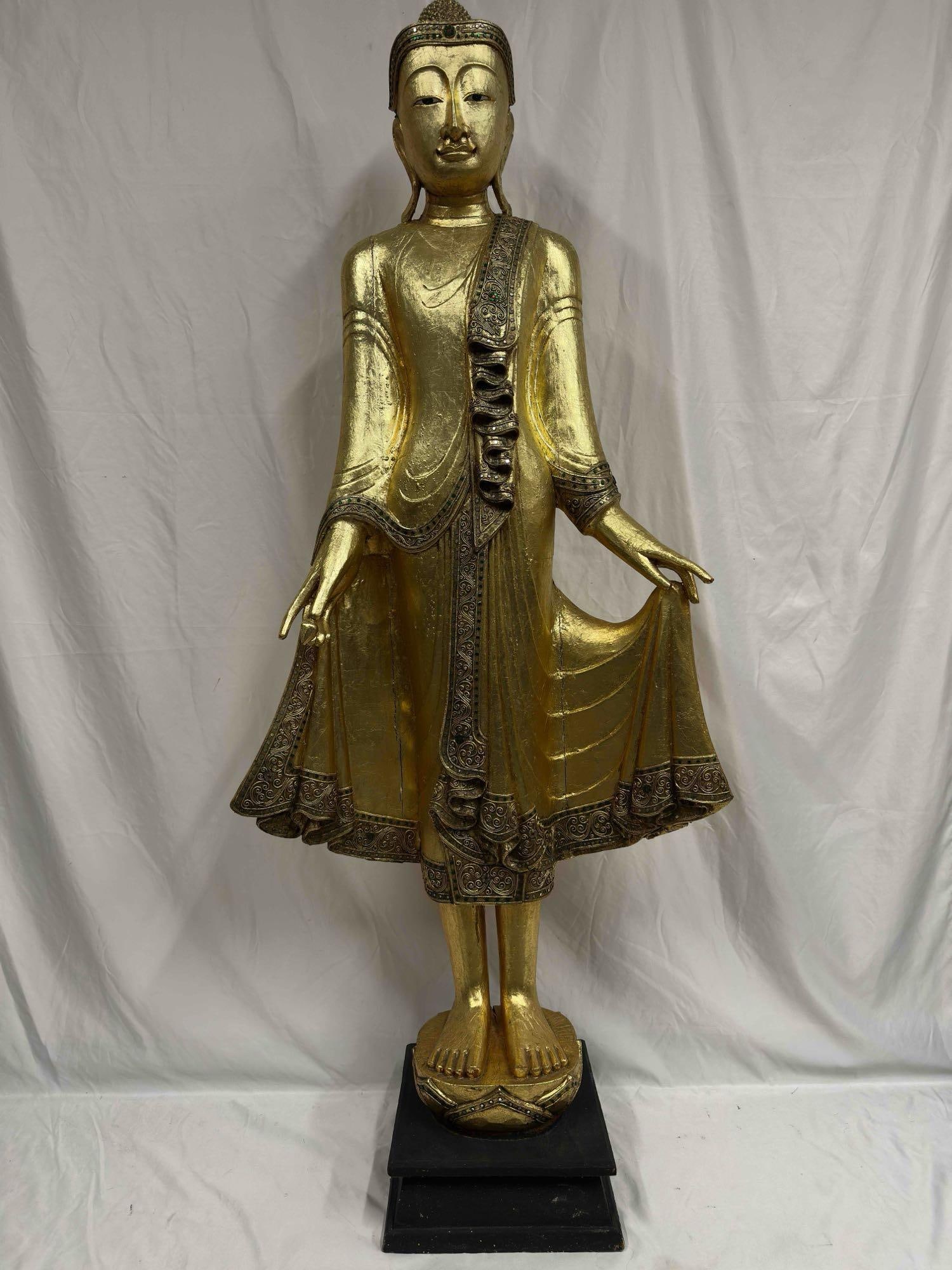 Burmese Mandalay Standing Buddha Statue Gold Gilded Tone and Simulated Glass Accents R119: Burmese Mandalay Standing Buddha Statue Gold Gilded Tone and Simulated Glass. Minor imperfections cracks on the statue, noticeable on robe. Some simulated glass accent pieces missing, have fallen off.