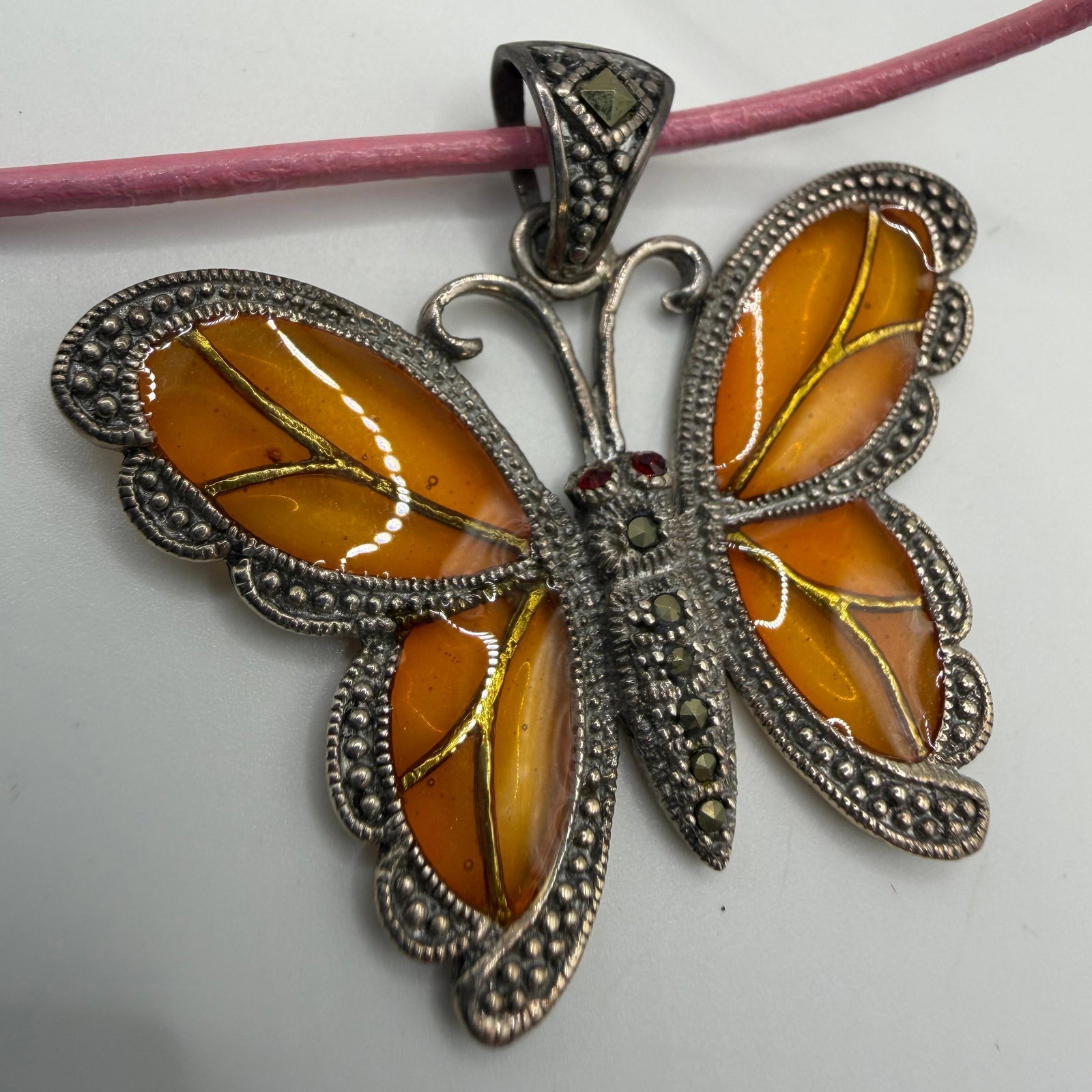 GSJ 925 Marcasite Garnet Sterling Silver Butterfly Pink Cord Necklace HG58: This item is in pre-owned, previously used/displayed condition with noticeable light wear and surface scratches. Please reference all photos for full details. This piece of jewelry has been tested and