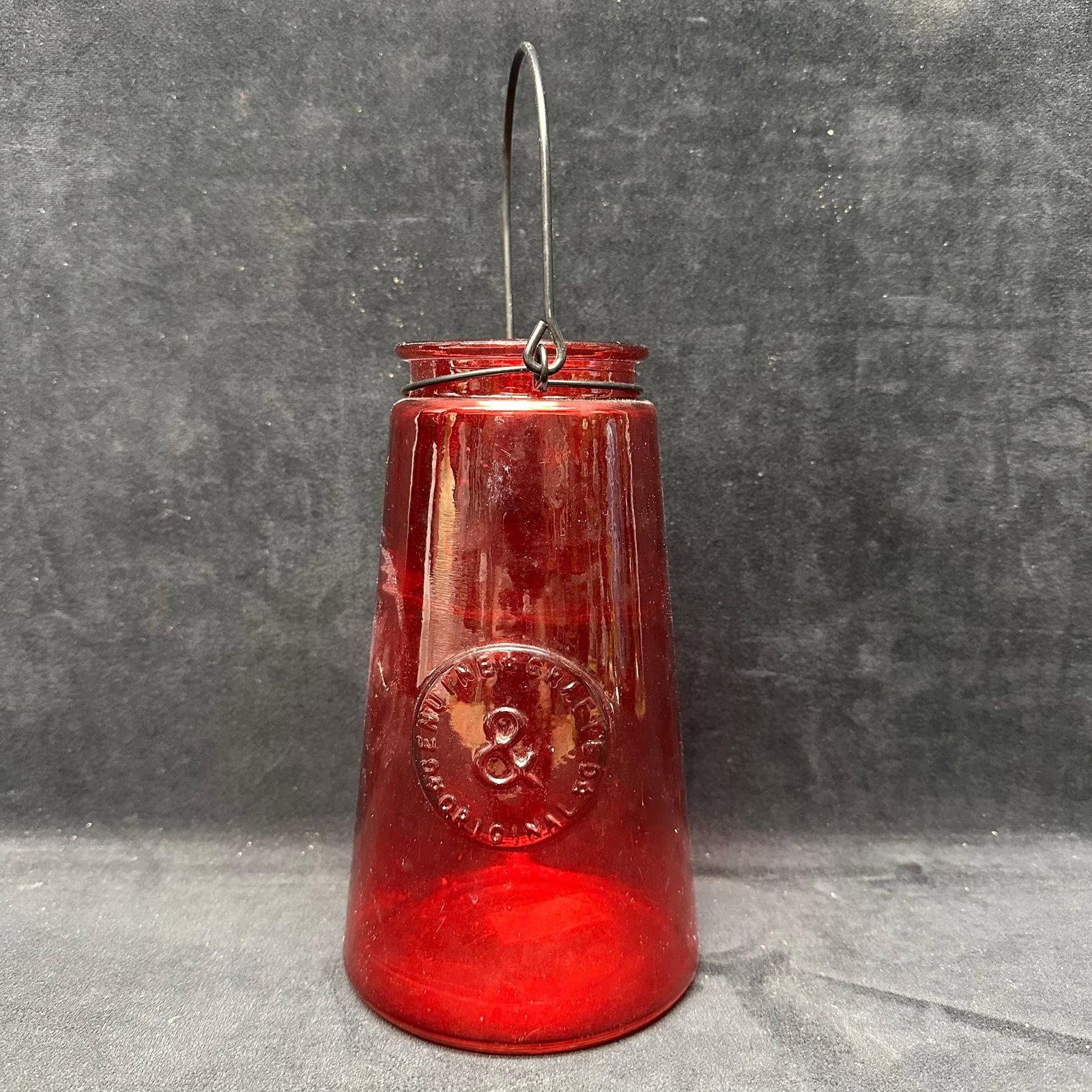 Embossed Red Glass Hanging Lantern Type Jar with Handle: This item is in pre-owned, previously displayed condition showing light wear, a few noticeable scratches, and surface markings. Please reference all photos for full details. Glass: 8 1/2" tall x 4