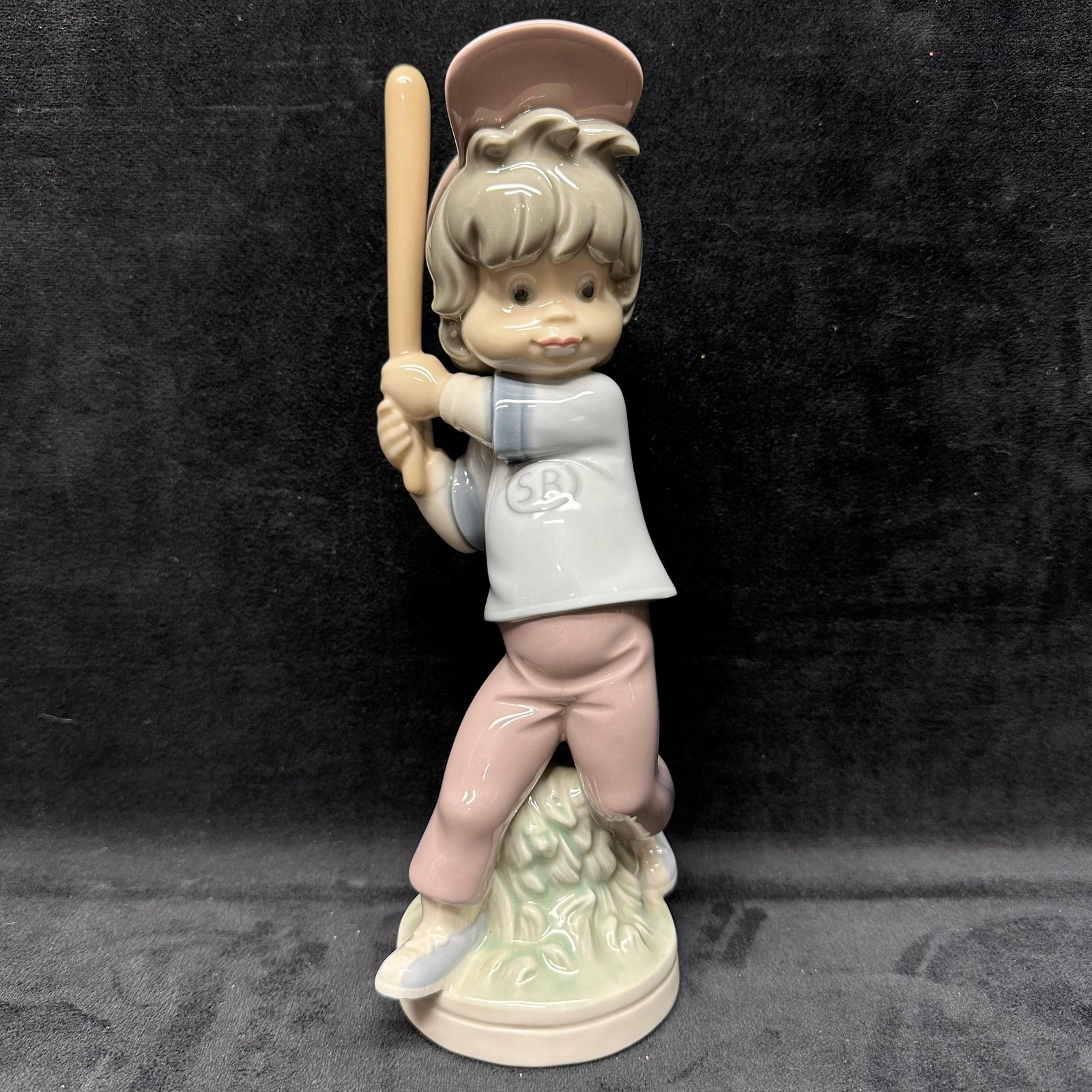 Lladro Porcelain Sport Billy Baseball Player Glazed Figurine: Hallmark of the bottom of the figure. Light markings under the bottom of the figure. This item is in pre-owned, previously displayed condition with light wear and surface scratches. Please reference