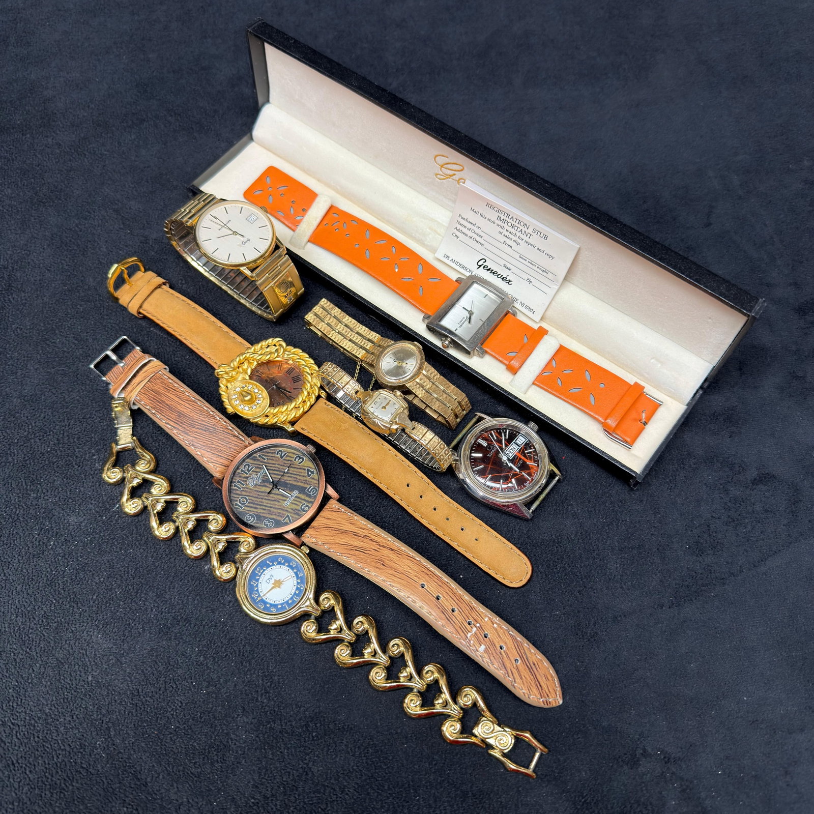 Assorted Vintage Wristwatches and Fashion Watch Lot: Collection of vintage wristwatches and fashion watches including a boxed Genevex ladies' watch with orange strap, men's and ladies' expansion-band watches, manual and quartz wristwatches, 