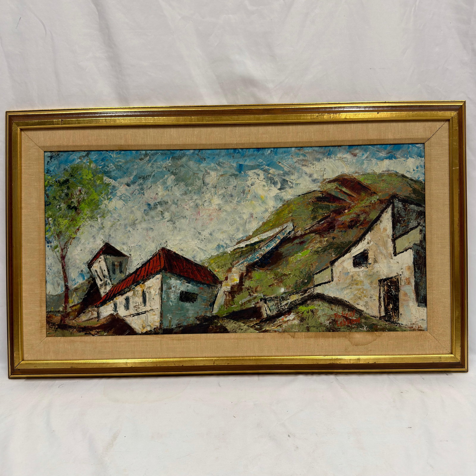 Robert LeBron Signed Oil on Canvas European Village Landscape Framed: Original oil on canvas depicting a hillside European village with whitewashed buildings and red rooftops beneath a textured blue sky. Signed Robert LeBron in red in the lower right. Presented in its o