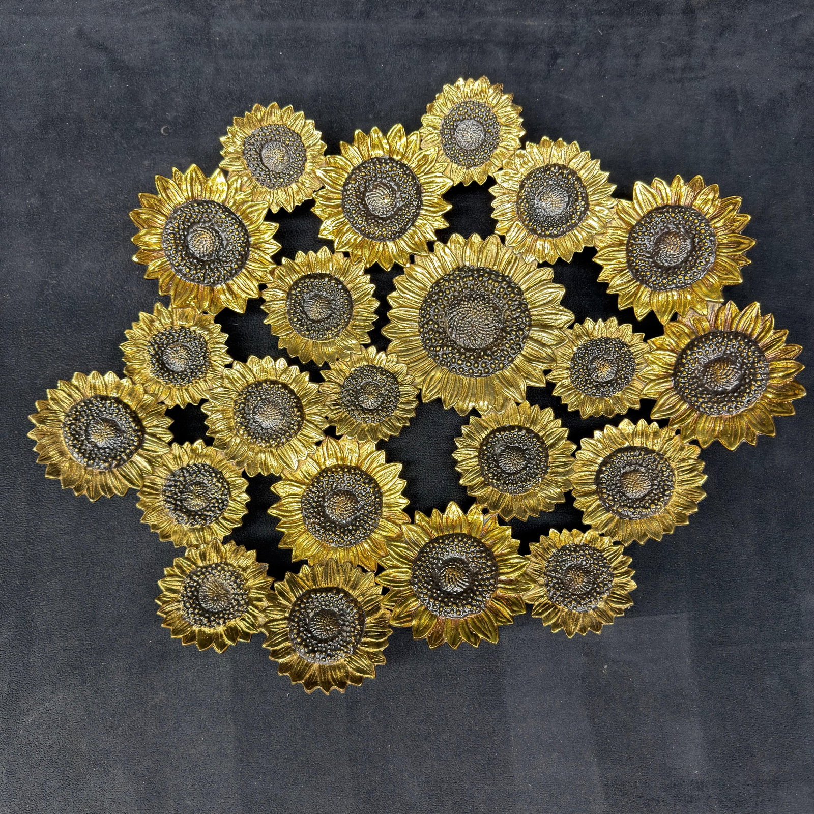 Michael Aram Oval Footed Vincent Sunflower Metal Centerpiece Bowl: Decorative Michael Aram centerpiece bowl from the sought-after Sunflower Collection. This sculptural cast metal bowl features a cluster of hand-finished sunflower blooms in rich gold and bronze tones 