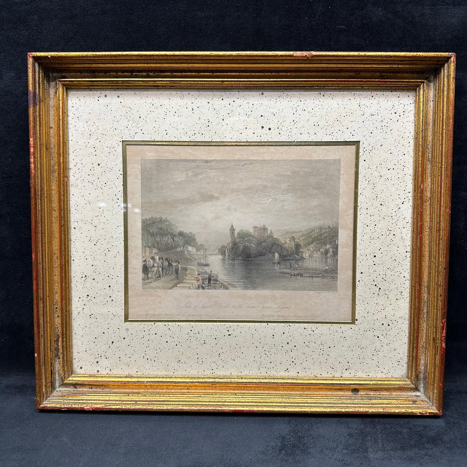 Antique Hand-Colored Engraving Isle of Sainte Barbe on the Saone Near Lyons Framed: Antique hand-colored engraving depicting Isle of Sainte Barbe on the Saone, near Lyons. Drawn by T. Allom and engraved by W. Le Petit, circa 1845. Presented in a gilt wood frame with speckled matting.