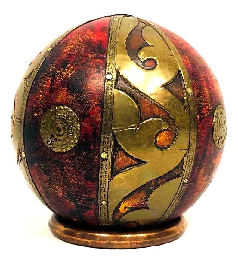 Decorative Burl Wooden Brass & Leather Ball With Copper Stand: This lot contains a Decorative Burl Wooden Brass & Leather Ball With Copper Stand. The circular base is approx 2 1/2" x 2 1/2" and the ball is approx 4" x 4". Together the base and ball weigh about 0.