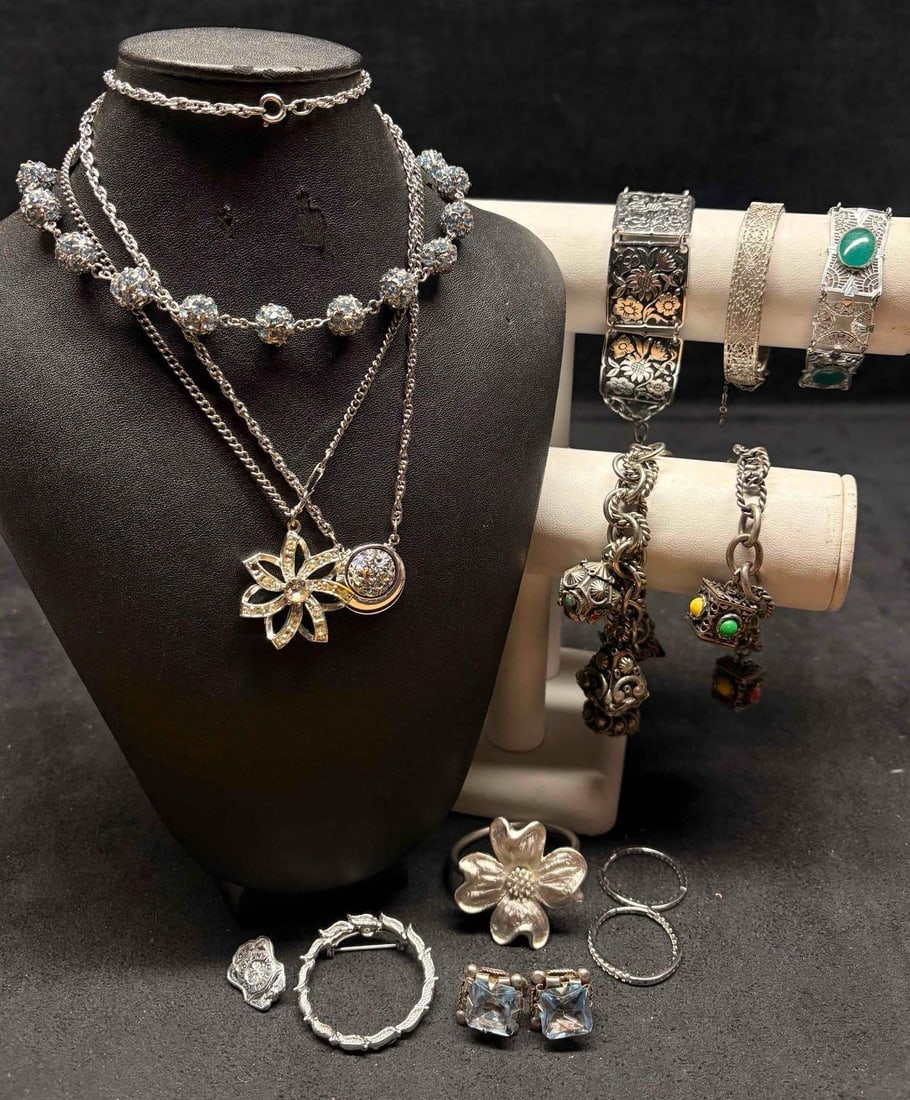13pc Silver Tone Gossamer & Glint Costume Jewelry Collection: This lot contains 13 pieces of pre-owned costume jewelry, paired together in a stylized set. Each piece is in good conditions, with wear and tear over the years visible on some of the jewelry. Please 