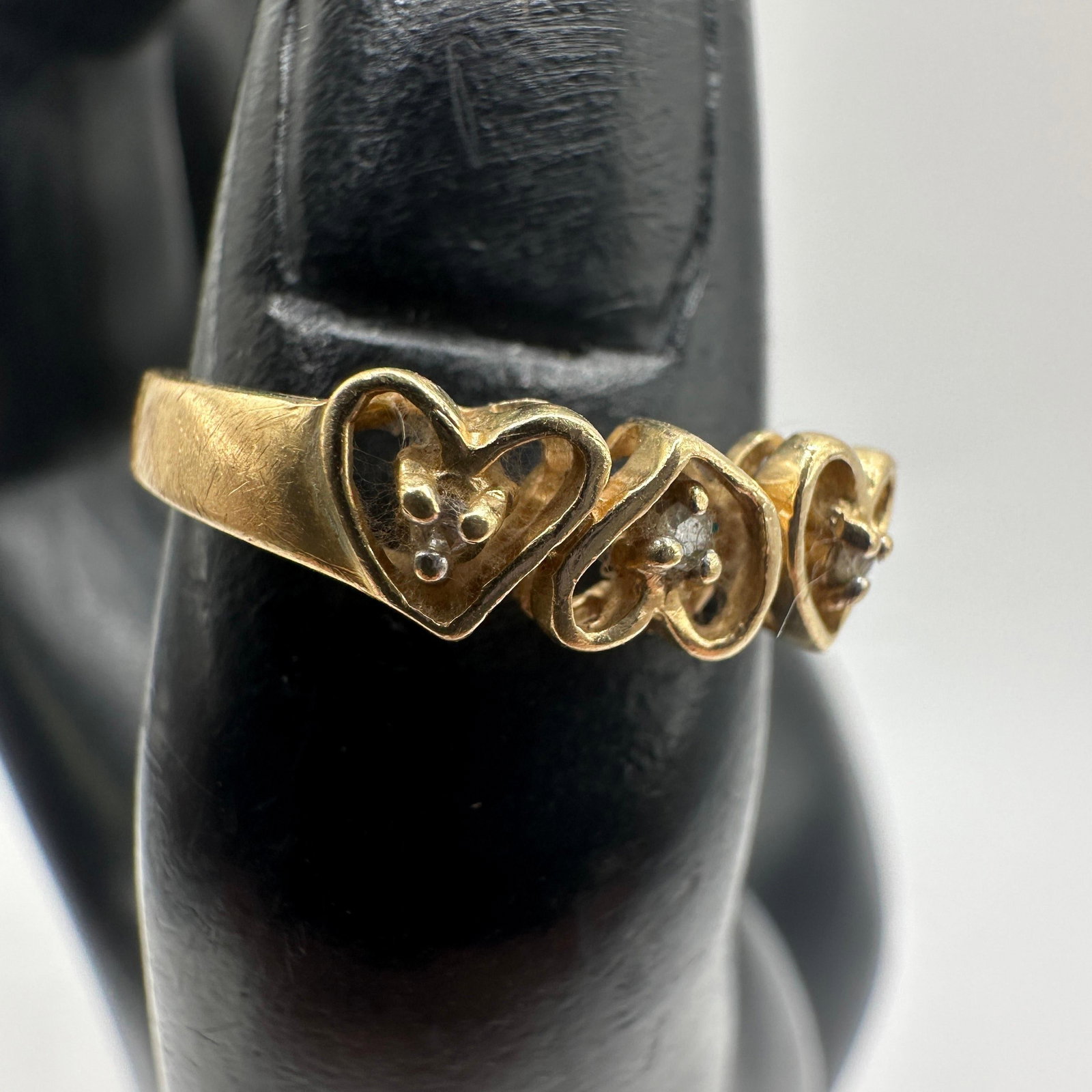 14K Yellow Gold Triple Heart Accent Diamonds Ring: This item is in good pre-owned, previously used/displayed condition with noticeable light wear and surface scratches. Please reference all photos for full details. This piece of jewelry has been teste