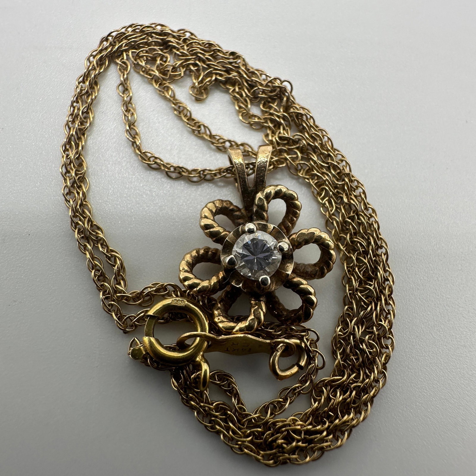 14K Yellow Gold Flower Diamond Pendant Necklace: This item is in good pre-owned, previously used/displayed condition with noticeable light wear and surface scratches. Please reference all photos for full details. This piece of jewelry has been teste