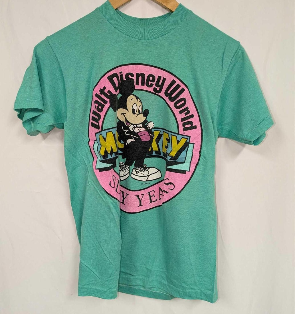 Disney World Mickey Mouse 60 Years S Shirt: Disney World Mickey Mouse 60 Years S Shirt. The tag has been removed. The shirt should be a small and 100% cotton. Folded, the shirt is approx 8" x 6" x 1" and it weighs 0.25lb. The shirt has some