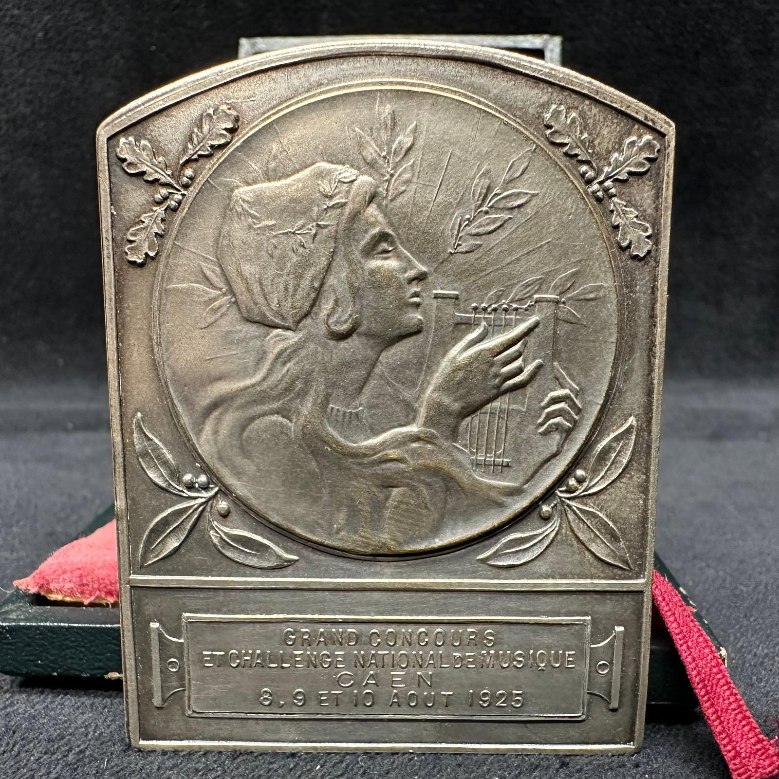 French Art Nouveau Bronze Medal Plaque Grand Concours de Musique Margueritat Paris: French cast bronze medal plaque commemorating the Grand Concours et Challenge National de Musique held in Caen, August 8–10, 1925. The relief depicts a classical female figure playing a lyre,