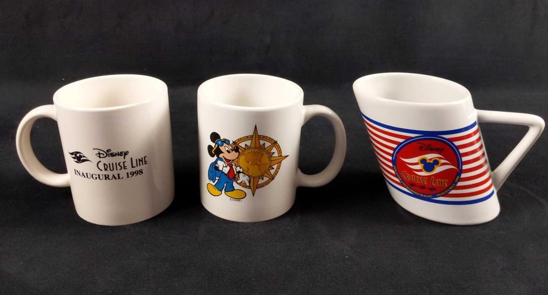Disney Cruise Line Mugs Lot Of Three: A'hoy There! This lot includes ceramic Disney Cruise Line Mugs: (1) Mickey Mouse with Earth Compass Mug. Is approx 5" x 3" 4". The mug is in good. used condition with a small chi