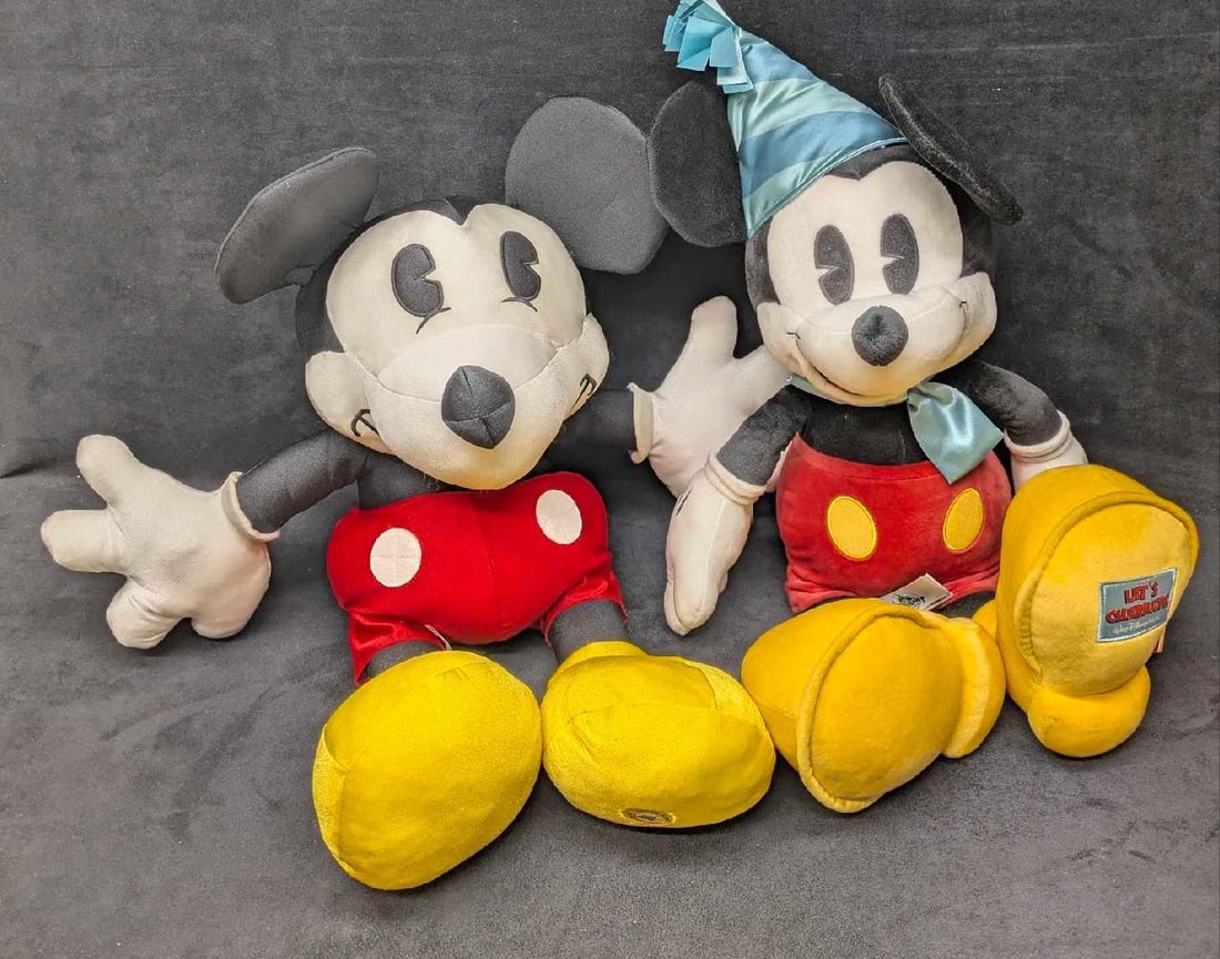 Large Let's Celebrate And Hong Kong Disneyland Mickey Mouse Plushes: Large Let's Celebrate And Hong Kong Disneyland Mickey Mouse Plushes. This lot includes: (1) Walt Disney World "Let's Celebrate" Plush Mickey Mouse. This is approx 22" x 13 1/2"