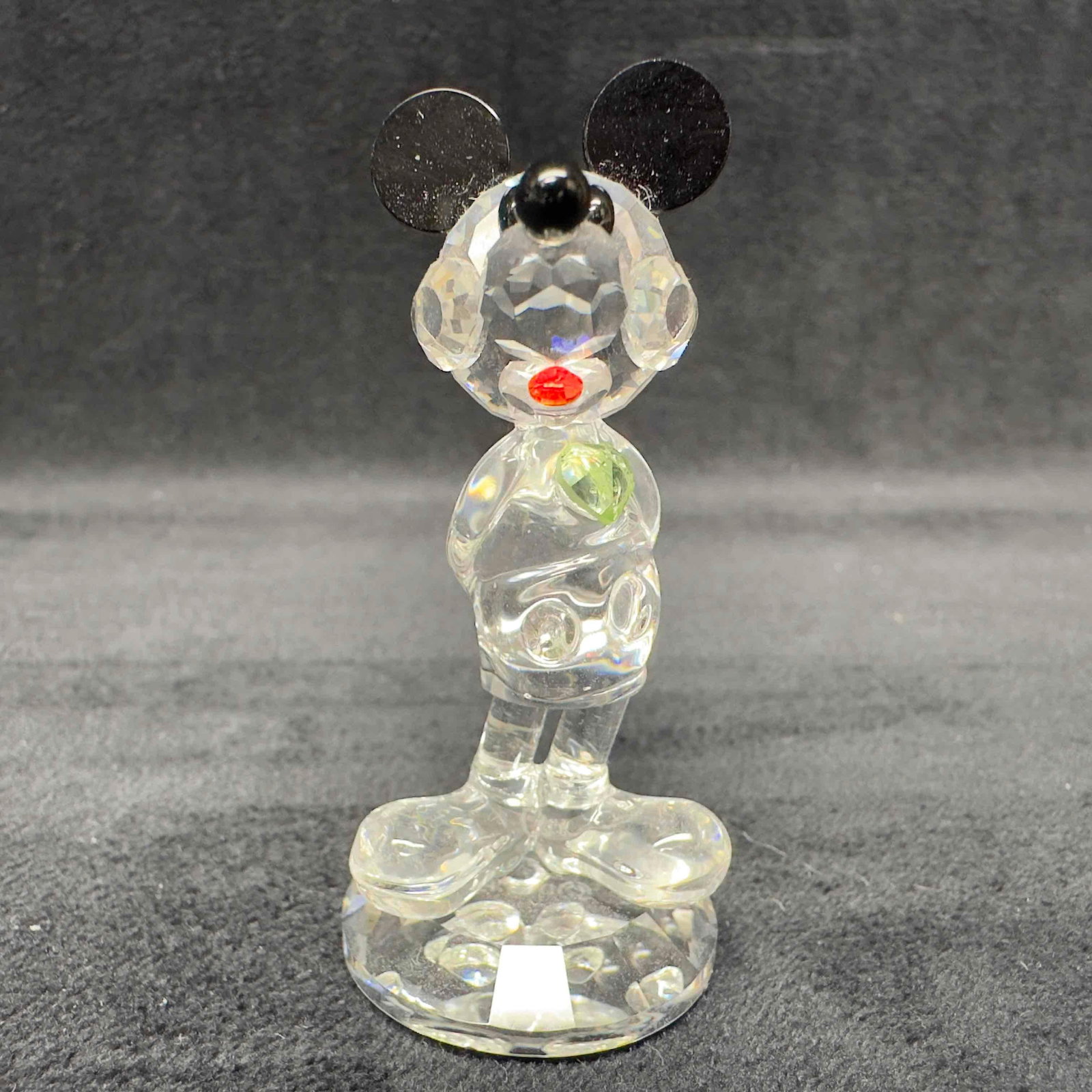 Arribas Disney Birthstone Mickey August Glass Crystal Figure DMS001-Aug Figurine: Arribas Disney Birthstone Mickey August Glass Crystal Figure DMS001-Aug Figurine. This retired glass figure features Mickey Mouse standing with an August birthstone heart accent. Includes original box