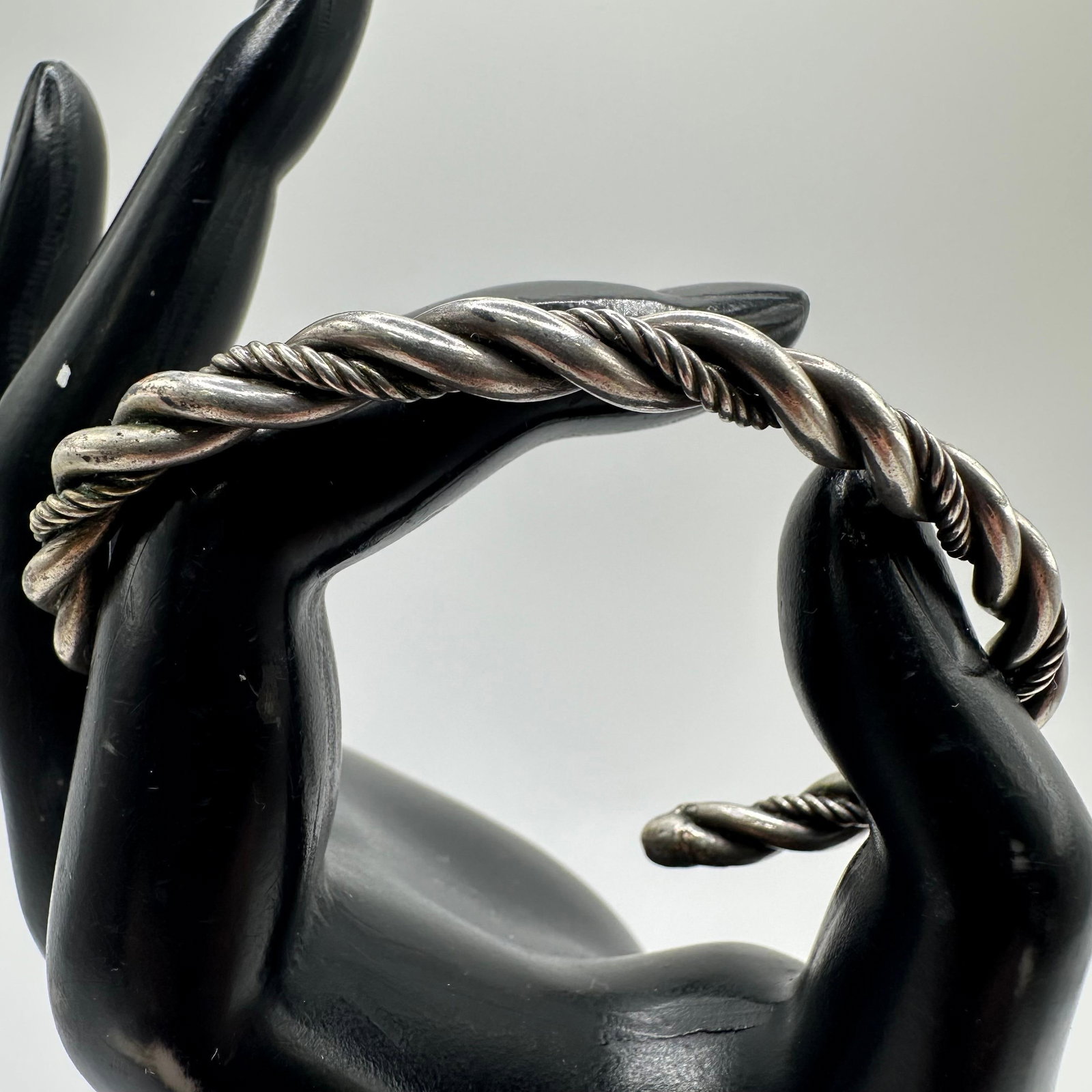 Silver Twisted Rope Cuff Bracelet X13: This item is in good pre-owned, previously used/displayed condition with noticeable light wear and surface scratches. Please reference all photos for full details. This piece of jewelry has been teste