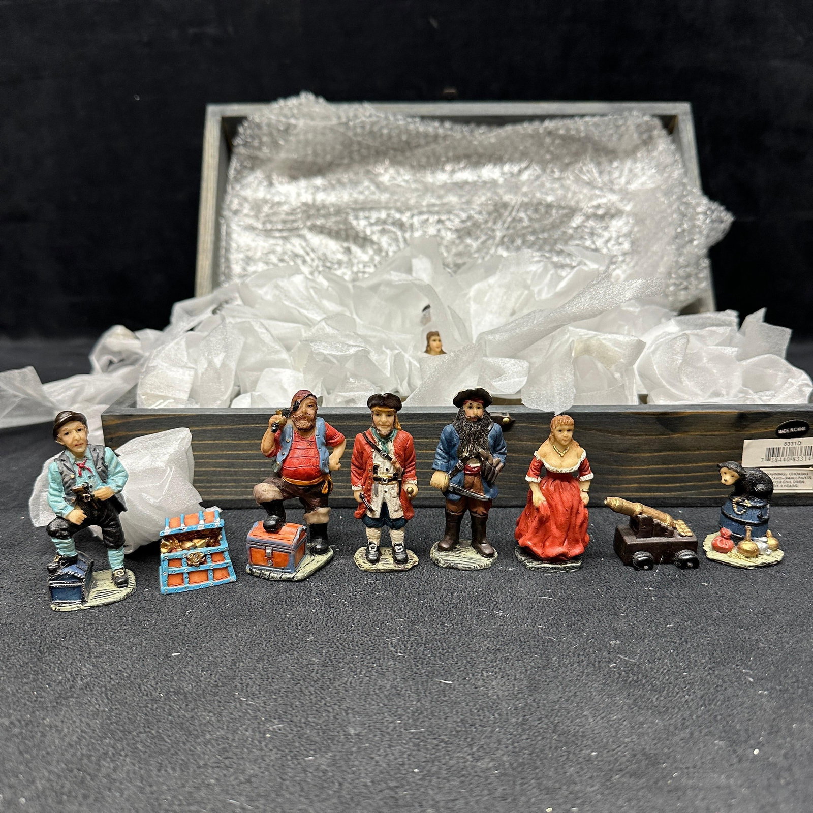 Pirate Themed Chess Set with Hand Painted Pieces Folding Board Box: Pirate-themed chess set featuring hand-painted figural pieces including pirates, treasure chests, cannons, and related motifs. Includes a full set of 32 pieces stored inside a wooden folding chess boa