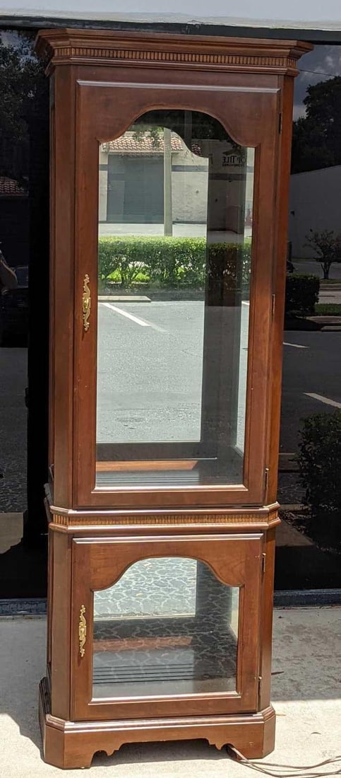 Tall Wood And Glass Curio Cabinet: Tall Wood And Glass Curio Cabinet. Maker and date of creation is unknown. The cabinet is approx 24" x 13" x 77". While the cabinet has no shelves inside, there are eight shelf pins for placing t