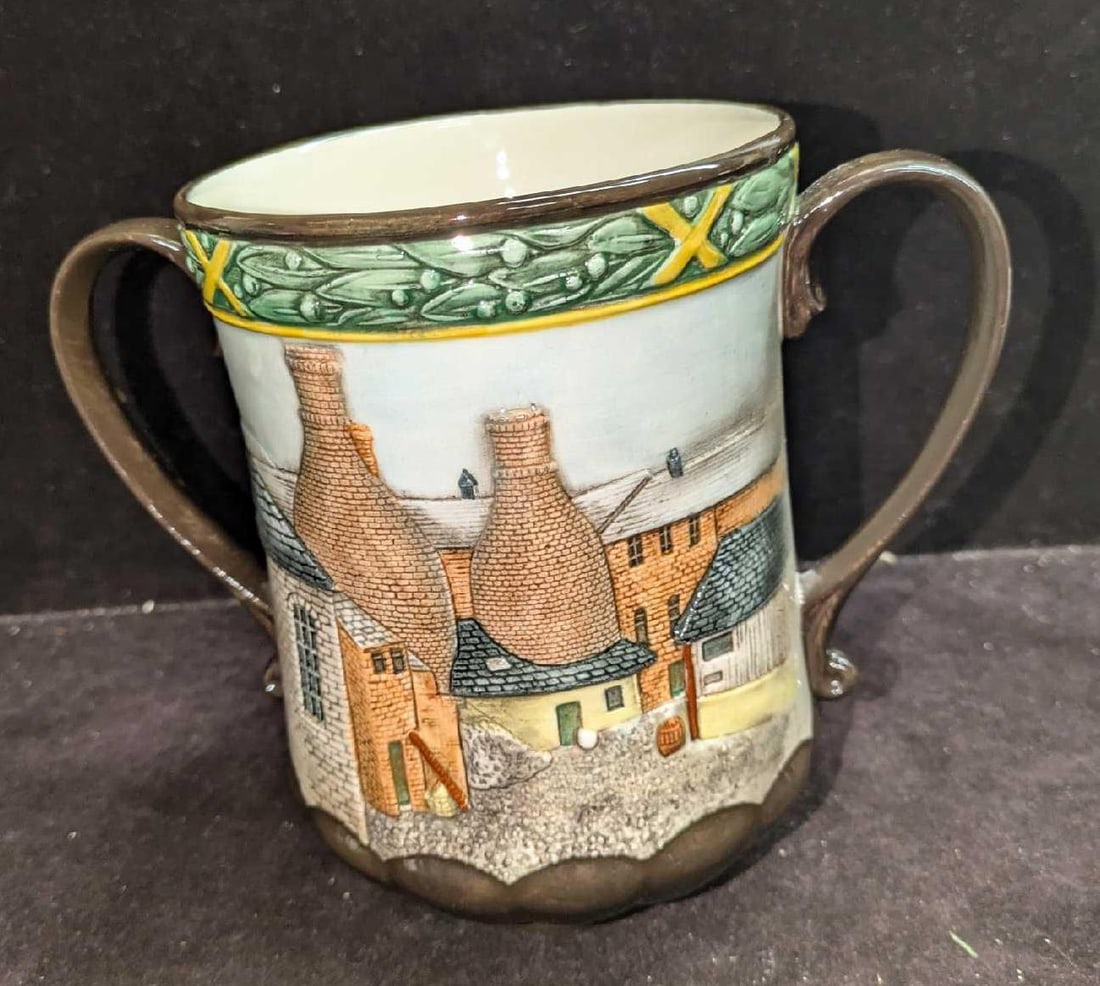 Retired Royal Doulton Pottery In The Past Loving Cup: Retired Royal Doulton Pottery In The Past Loving Cup. This is approx 8" x 5" x 6 1/4" and it weighs 1.48lb. This was designed by Graham Tongue and was made of china. The cup has no chips or crack
