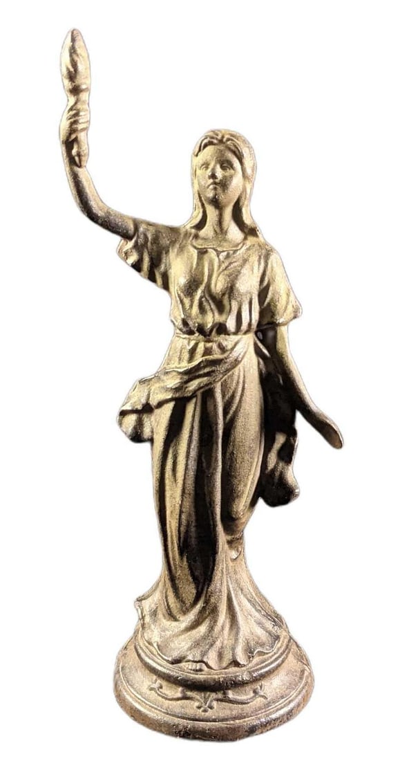 Vintage Wrought Iron Woman With Torch Figurine: Vintage Wrought Iron Woman With Torch. The maker and date of creation are unknown. The figurine has an opening in the back. This might have been where wings or another accessory was mounted. Is a