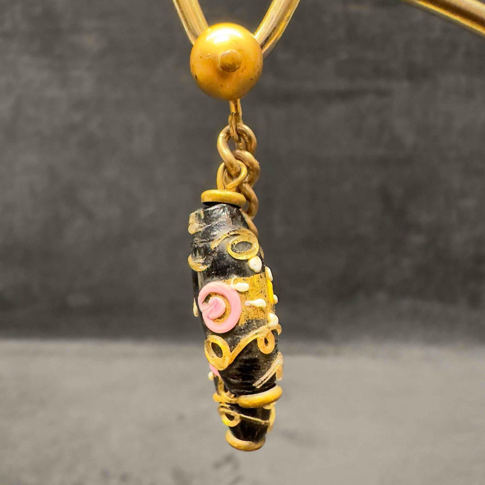 Murano Venetian Art Glass Lamp Work Black Floral Gold Toned Bead Dangle Drop Earrings F24: Murano Venetian Art Glass Lamp Work Black Floral Gold Toned Bead Dangle Drop Earrings F24. Earrings with black glass beads with beautiful designs on each. The earrings feature floral and gold colored 