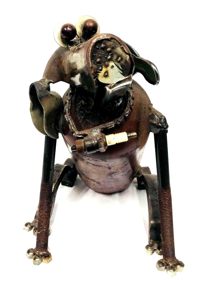Steel/IronFolk Art Dog Sculpture: This lot contains a Steel/IronFolk Art Dog Sculpture. It is approx 17" x 9" x 14 1/2" and it weighs about 16lbs. Overall the Dog sculpture is in good used condition with some light wear from use over 