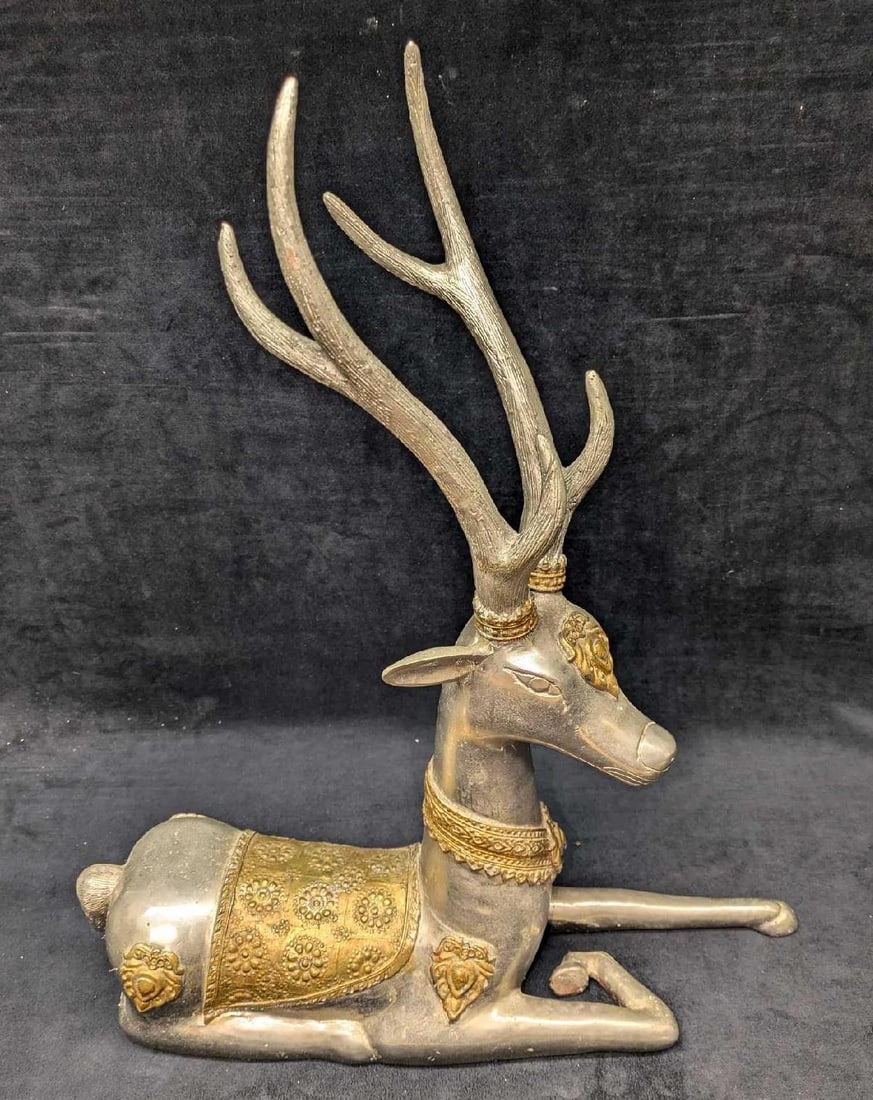 Vintage Metal Brass And Silver Tone Reindeer Statue: Vintage Metal Brass And Silver Tone Reindeer Statue. This is approx 18" x 5 1/2" x 20" and it weighs 22.80 lbs. The maker and date of creation is unknown. There are some markings, light surface rust a