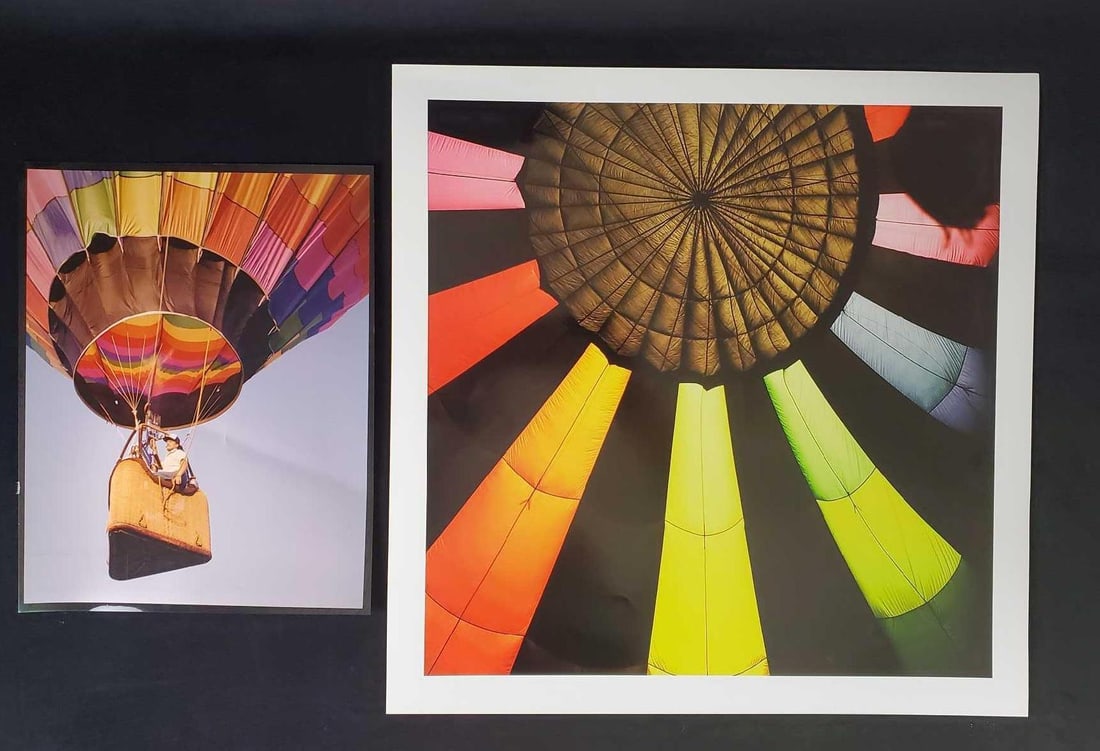 Large Colorful Hot Air Balloon Photos Lot Of Two: This lot includes two very glossy and professionally shot photos of: (1) Detailed close up of hot air balloon operator in basket. This photo has a black border and is approx 11" x 14".