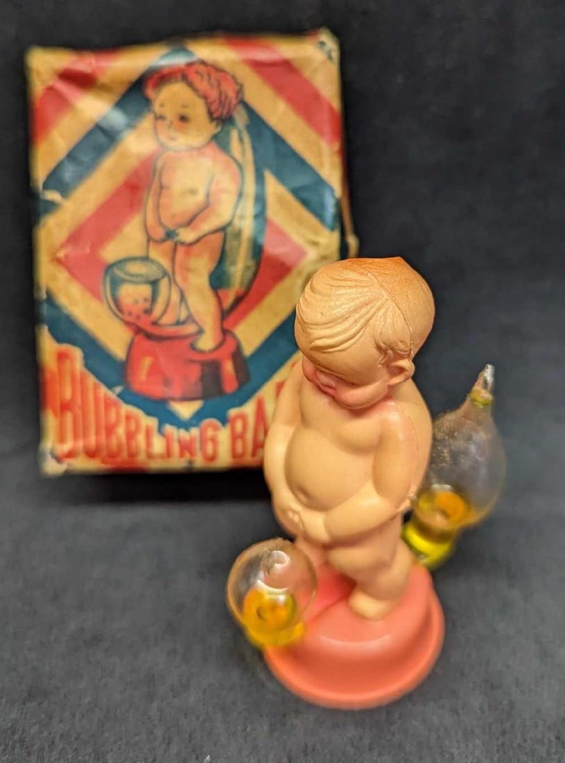 Vintage Bubbling Baby Novelty Toy: Vintage Bubbling Baby Novelty Toy. The heat from your hand makes the water bubble. The toy is approx 1" x 1 1/2" x 3". It comes in its original box which is approx 2" x 3" x1 1/4" and it weighs