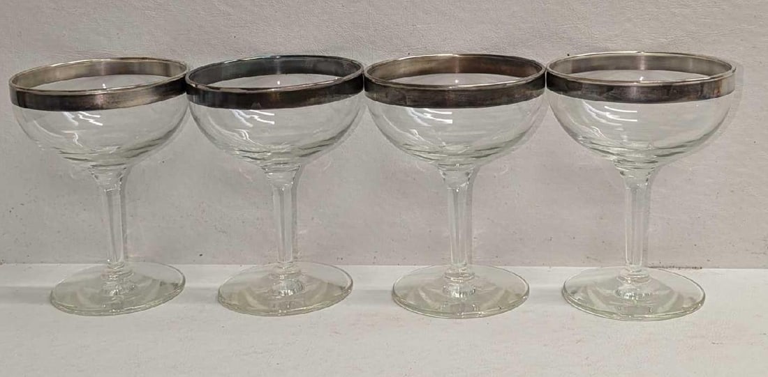 4 Vintage Silver Rimmed Champagne Couple Glasses: 4 Vintage Silver Rimmed Champagne Couple Glasses. These are not marked, but they are very similar to the "Dorothy Draper" glasses from the 1960s. Each is approx 4 1/2" x 3 1/2" x 3 1/2" and the total 