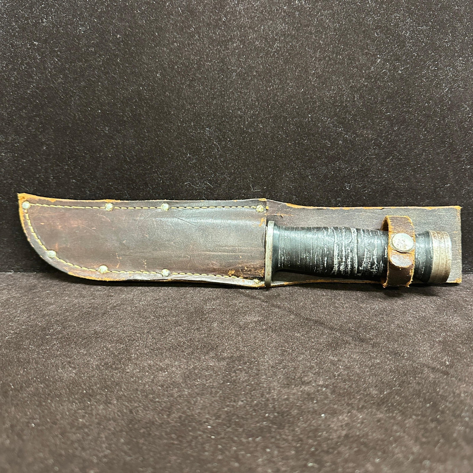 Cattaraugus 225Q Hunting Knife with Brown Leather Sheath: Vintage Cattaraugus Cutlery Co. model 225Q fixed blade hunting knife with stacked leather/wooden style handle and original brown leather sheath. Blade is marked "Cattaraugus 225Q" and features