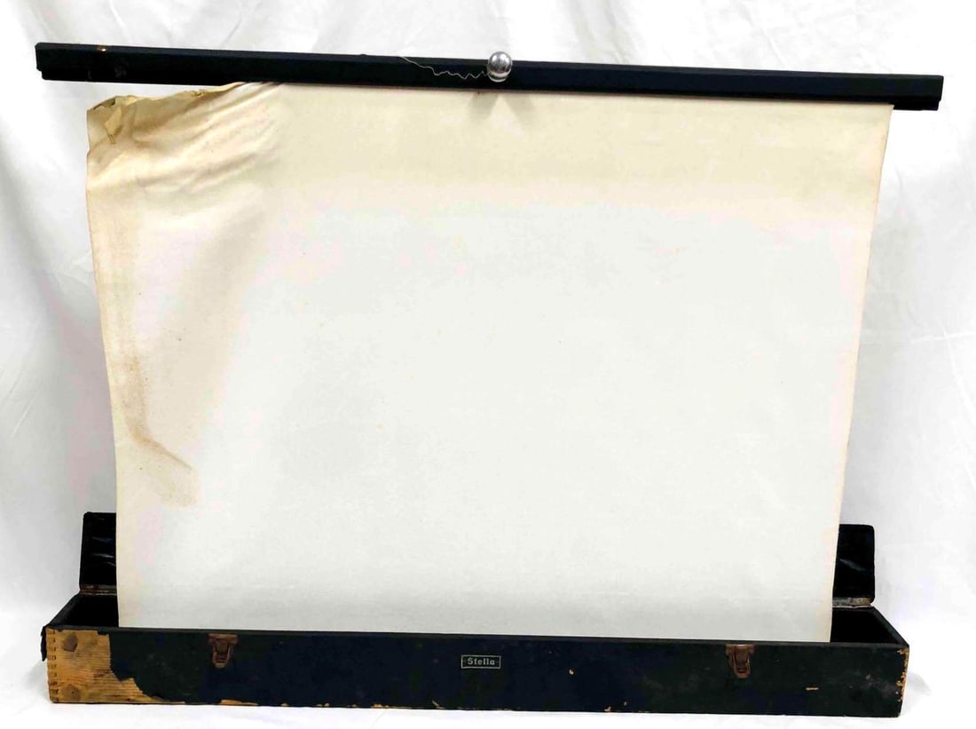 Vintage Stella Boxed Up Portable Projector Screen: This lot contains a Vintage Stella Boxed Up Portable Projector Screen. It is approx 4 3/4" x 4 1/2" x 45" and it weighs about 13.3lbs. Overall the Projector Screen is in good used condition 