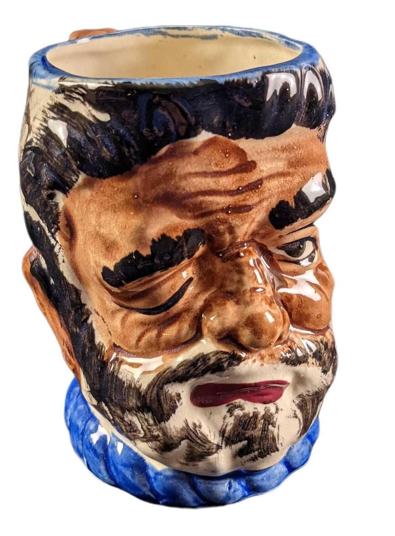 Toby Style Face Mug Bearded Mountain Man: Toby Style Face Mug Bearded Mountain Man With Squirrel Handle. Was made in Occupied Japan (1945 through 1951). The mug is approx 5" x 3" x 5" and weighs under one pound at 0.68lb. The mug is in a