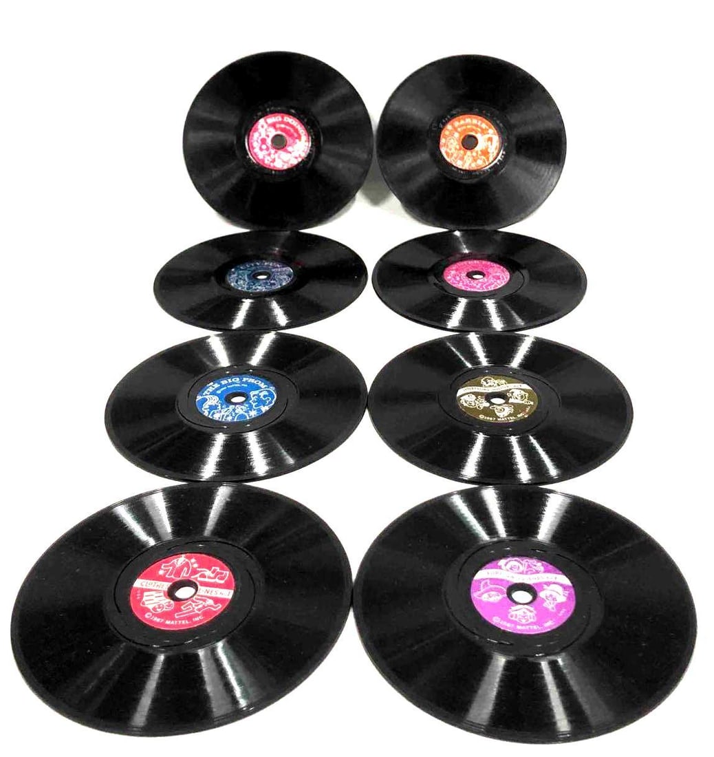 Eight Vintage Mattel-O-Phone Records: This lot contains eight vintage Mattel-O-Phone records. The records are each approx 4" x 4" and altogether they weigh about 0.2lbs. Overall the records are in good used condition with some light wear 
