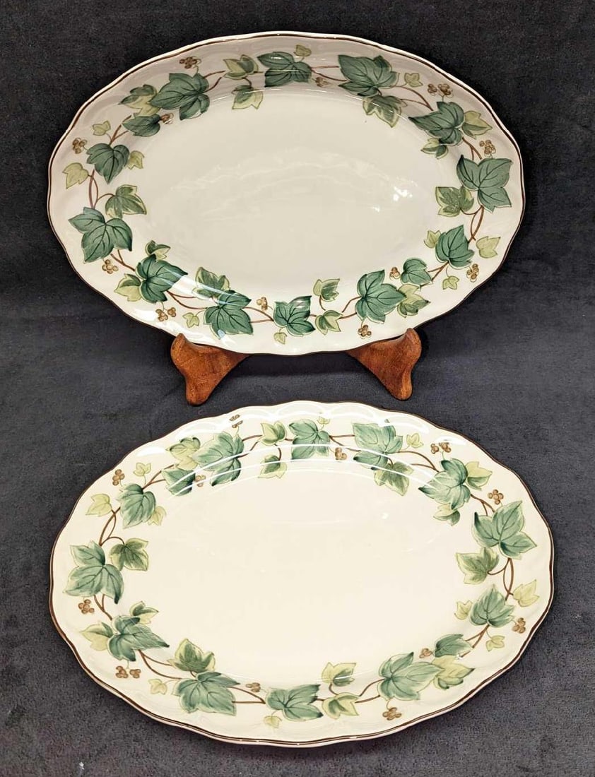 2 Retired Nikko Greenwood 11" Oval Serving Trays: 2 Retired Nikko Greenwood 11" Oval Serving Trays. This series was released from the year 1995 to the year 2004. Each is approximately 11 7/8" x 9 1/4" x 1". The total weight is 2.59 lbs. One of the pl