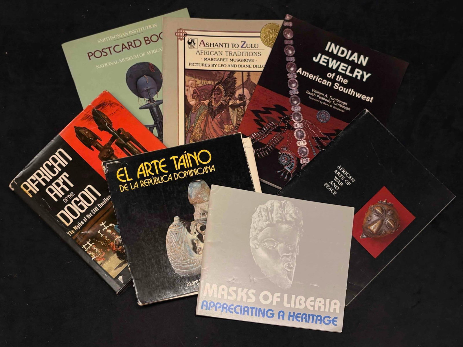 1970s to 1980s Curated Book Lot of Afro and Indigenous Heritage: This lot includes published books throughout the 70s and 80s, discussing the Arts, Culture, and History of varying diasporas. The particular focus of this collection centers Afro-I