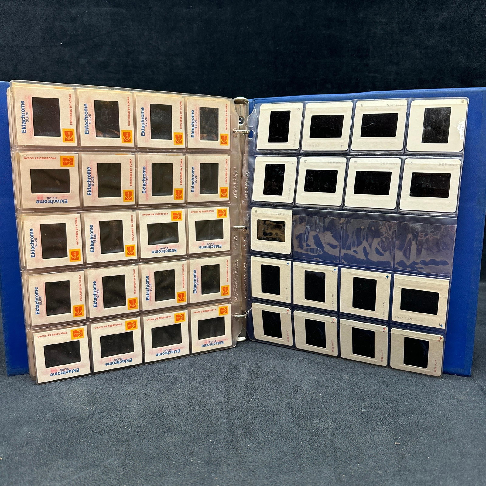 Large Collection of Vintage Kodak Kodachrome and Ektachrome 35mm Slides: A large collection of vintage Kodak Kodachrome and Ektachrome color transparency slides housed in protective plastic sleeves within binders. Includes numerous travel, landscape, waterfall, boating, po