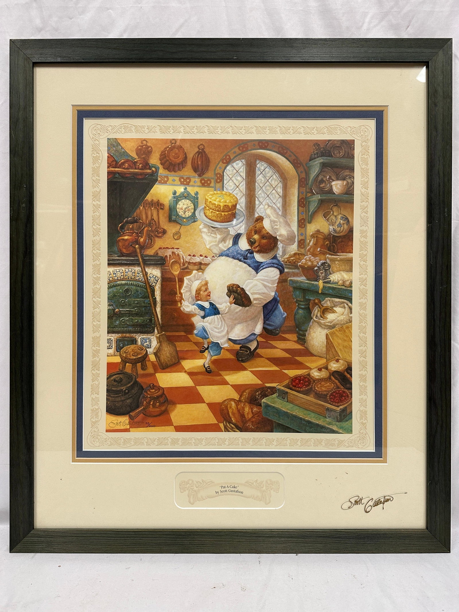 Scott Gustafson Pat-A-Cake Hand Signed Glass Art Print Numbered: Framed limited edition print titled Pat-A-Cake by renowned fantasy and children's book illustrator Scott Gustafson. The whimsical composition depicts a mother bear baker and child in a richly deta