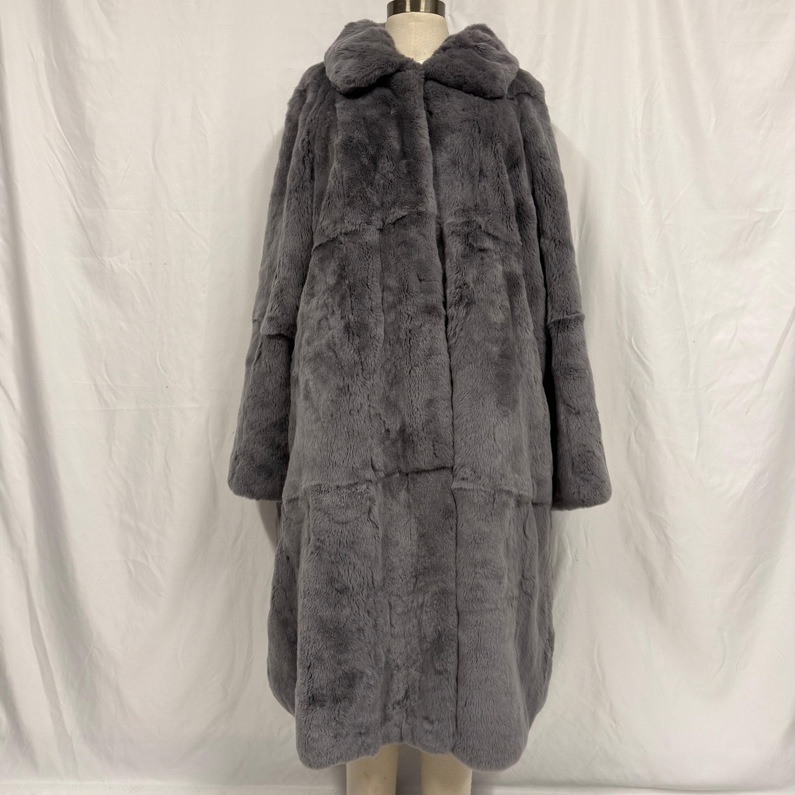 Gray Rabbit Fur Coat Full Length Long: The fur coat appears to be crafted from genuine fur (exact species unknown) and retains excellent volume and softness. Overall, the Fur Coat is in good pre-owned condition, with some light wear from s