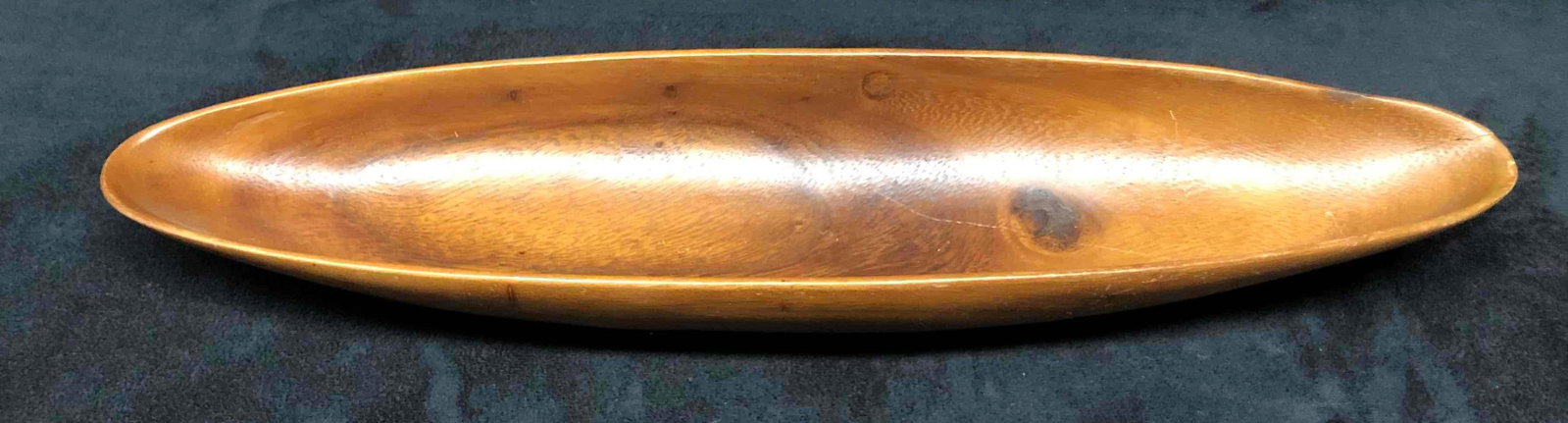 Monmayne Philippines Wood Bowl: This lot contains a Monmayne Philippines Wood Bowl. It is approx 15" x 3 1/4" x 2" and it weighs about 0.1lbs. Overall the wood bowl is in good used condition with some light wear from use over t