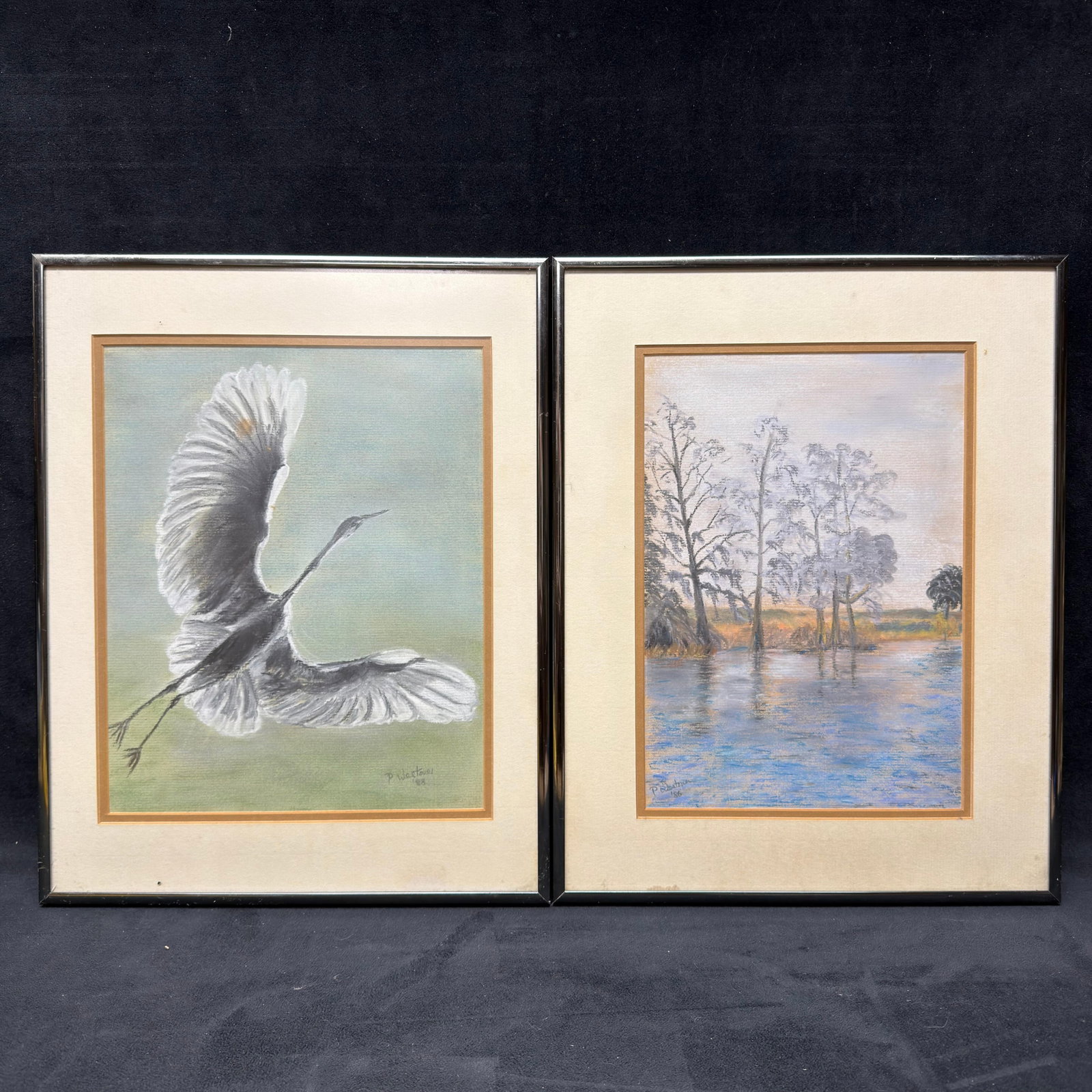 Pair of Signed Original Pastel Paintings Wildlife Bird and Landscape: Pair of original pastel paintings by an unknown artist, signed, dated 1986 and 1988. The collection includes: Great Egret in Flight, signed and dated 1988 Tranquil Waterscape with Cypress Trees, signe