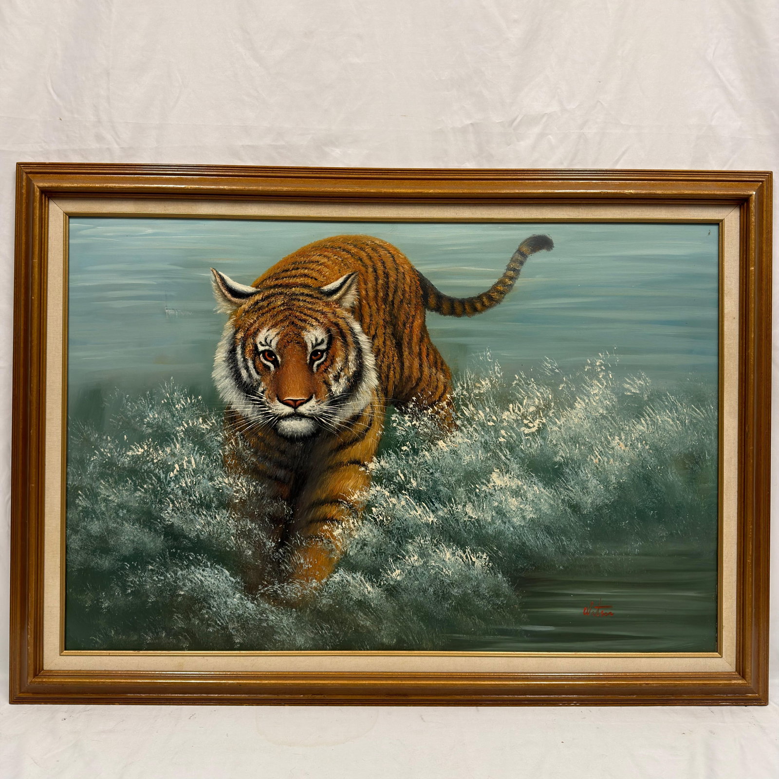 Signed Wildlife Oil on Canvas Painting of Bengal Tiger in Water Framed: Original oil on canvas depicting a powerful tiger striding through water, crashing surf. Executed in a realistic wildlife style with excellent attention to detail and vibrant coloration. Signed lower 