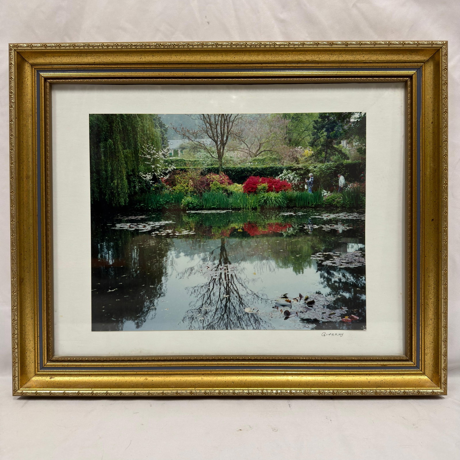 Giverny Framed Color Photograph Print of Claude Monet Garden: Framed color photographic print titled "Giverny," depicting the tranquil pond and lush gardens at Claude Monet's famous estate in Giverny, France. The print bears the title "Giverny