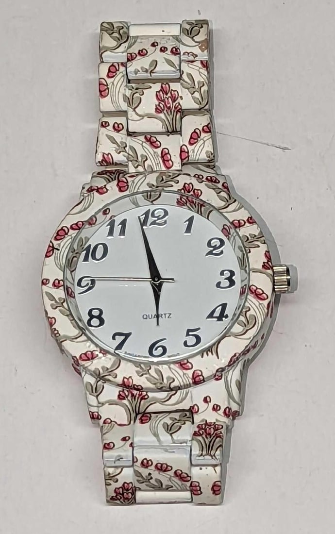 Ladies Watch Flower: Ladies Watch Flower. This is approx 1 1/2" x 3/4" x 3 1/4" and it weighs 0.20lb. Movement: Quartz Water Resistant: Does Not Say. Case Size: 38mm Band Material: PVC and silicone cover
