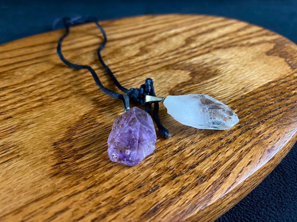 Amethyst & Quartz Necklace: Amethyst & Quartz Necklace String necklace with uncut quartz and amethyst pendants. Stones appear to be natural and are a nice size. String length is about 18". Approximate size: 1.5" x