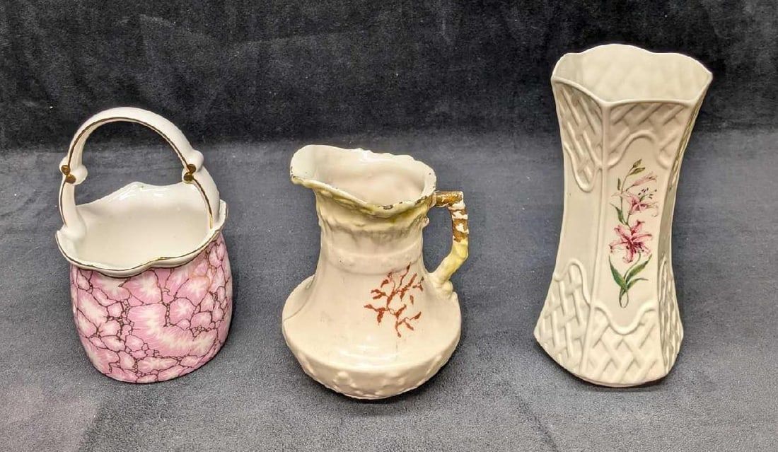 Vintage Porcelain Vases And Pitcher: Vintage Porcelain Vases And Pitcher. This lot includes: (1) Belleek Irish Pottery Country Trellis Painted Pink Lily Vase. This is approx 3 1/4" x 3 1/4" x 6 7/8". There is a very small chi