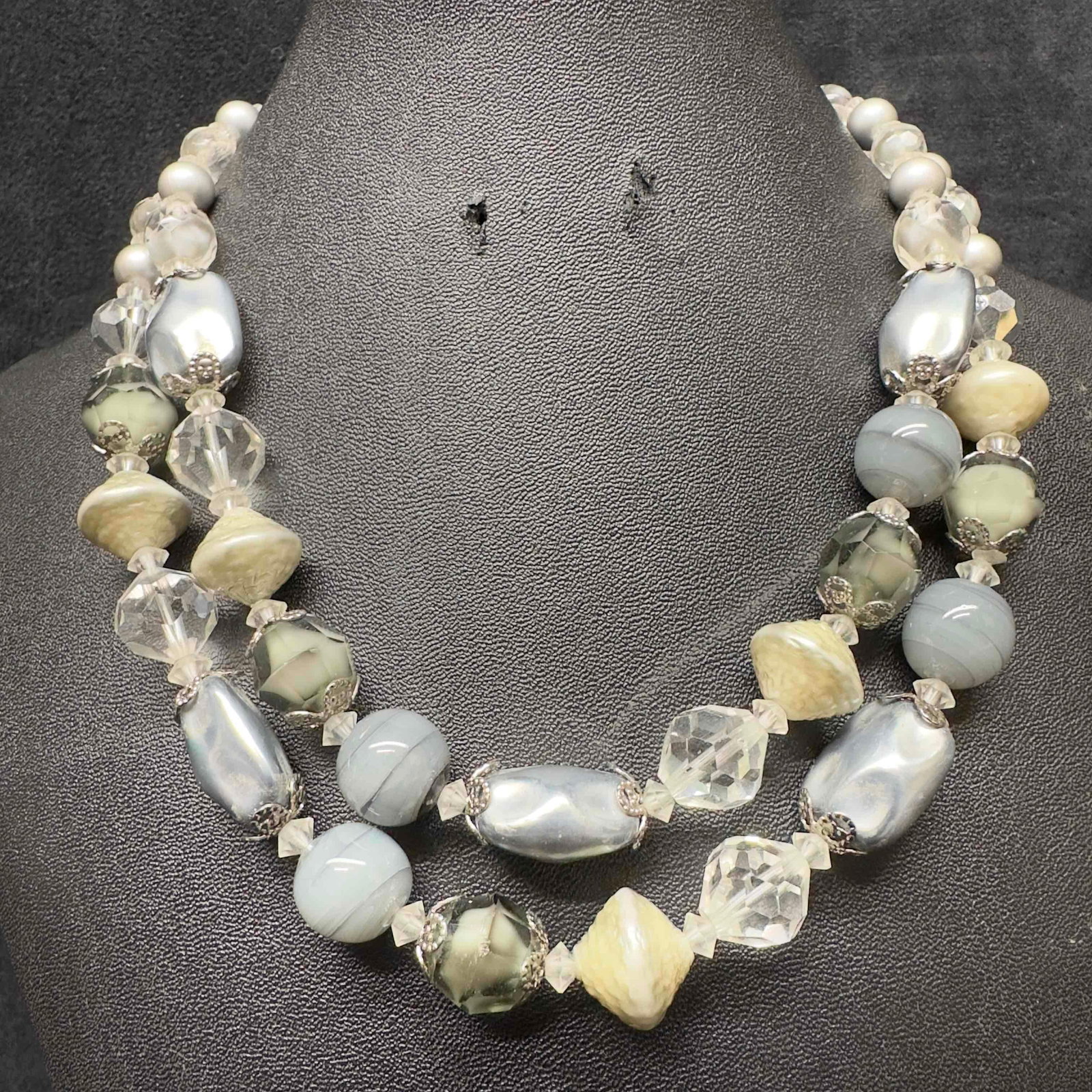 Vendome Clear Gray Silver Crystal Beaded Double Strand Necklace H92: Vendome Clear Gray Silver Crystal Beaded Double Strand Necklace H92. Necklace with clear, gray, and silver colored glass beads with beautiful designs. The necklace features a j hook clasp closure