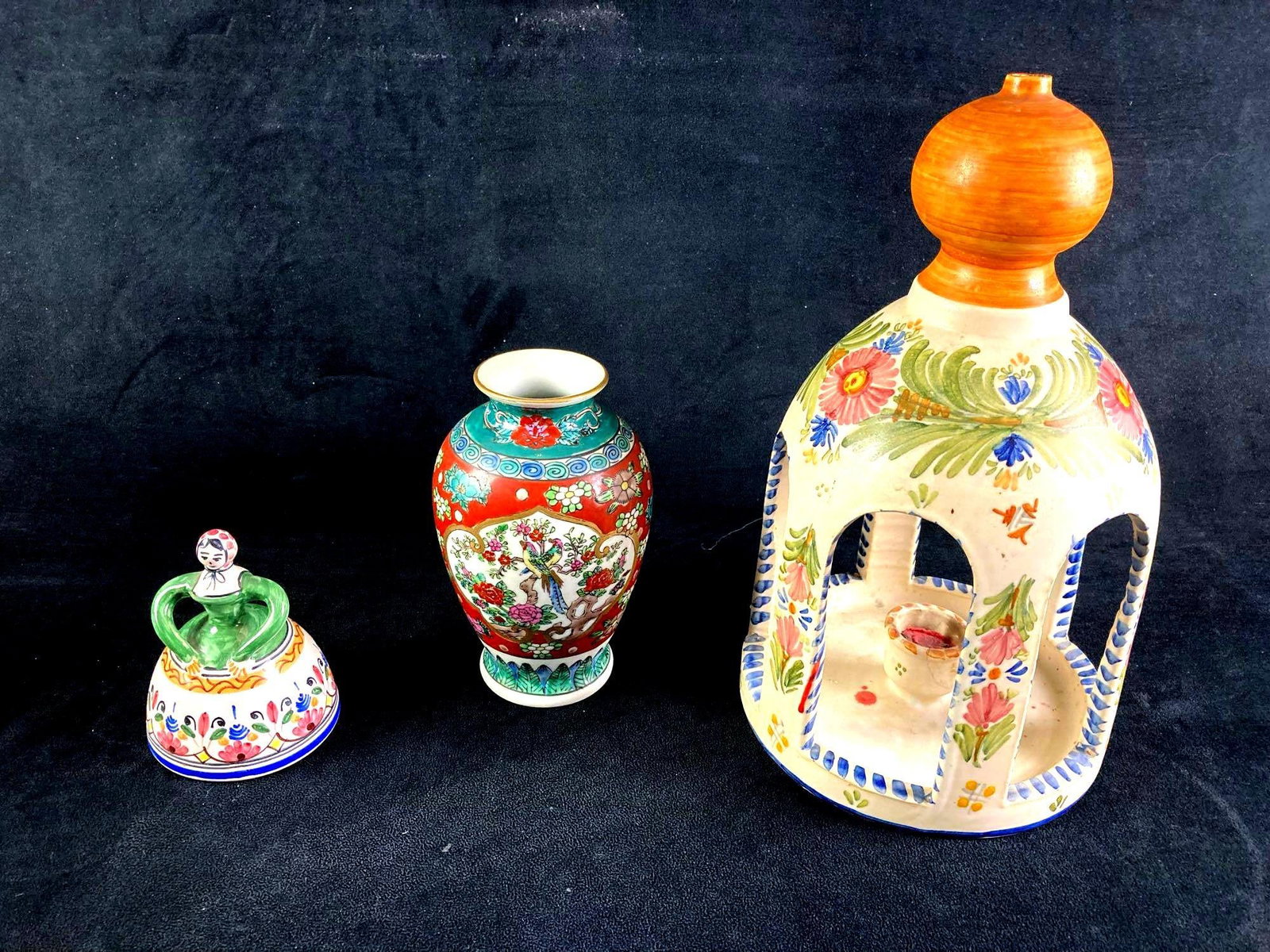 World Set of Pottery (3) Pieces: Up for auction is a recent estate find, a set of three pottery pieces ranging from a bell to a lantern. One item is a small Gold Imari vase made with decorative and virbrant colors. The Spanish candle