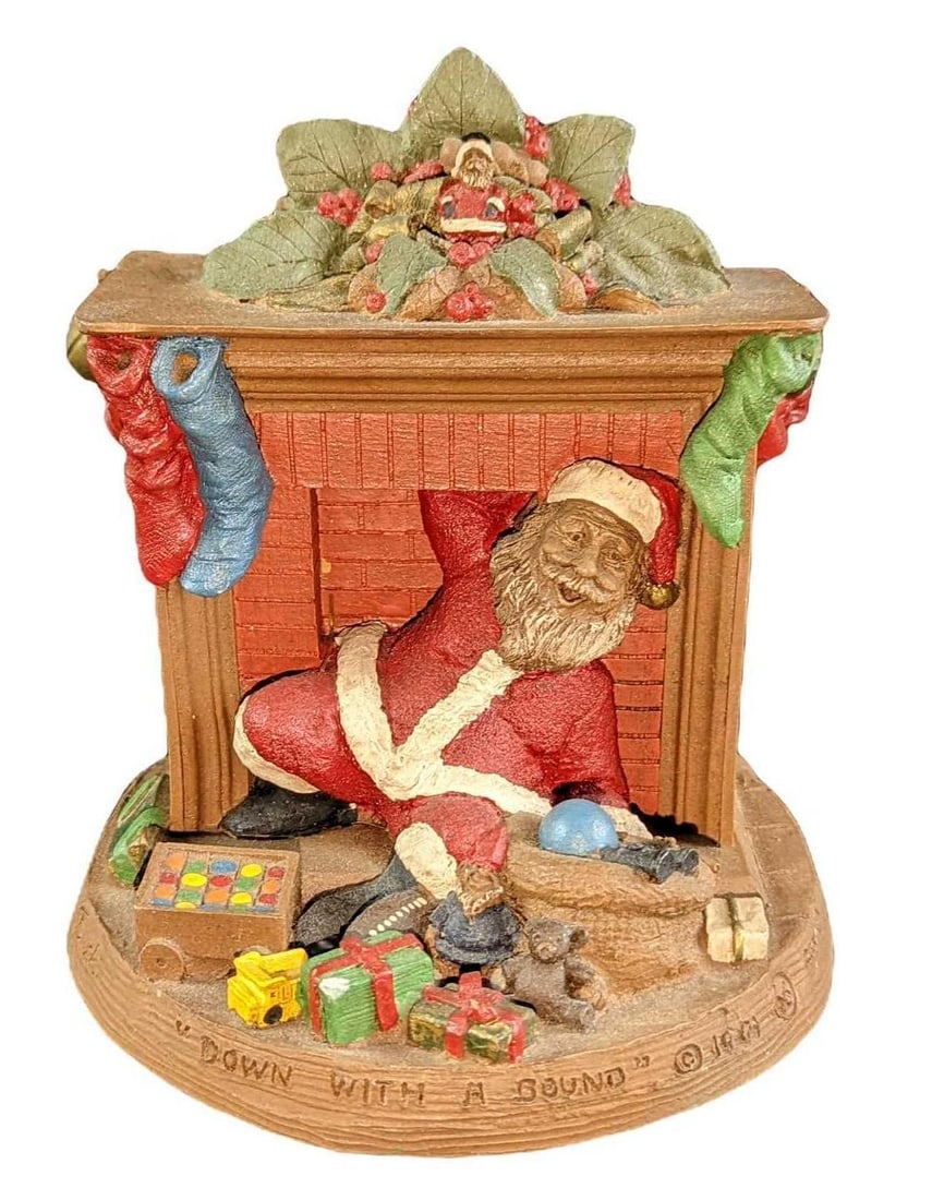 Thomas Clark Christmas Down With A Bound Bookend: Thomas Clark Christmas Down With A Bound Bookend. This was released from 1990 to 1999. It is made of hand-painted resin. The bookend is approx 6" x 5" x 7" and it weighs 2.33lbs. The booke