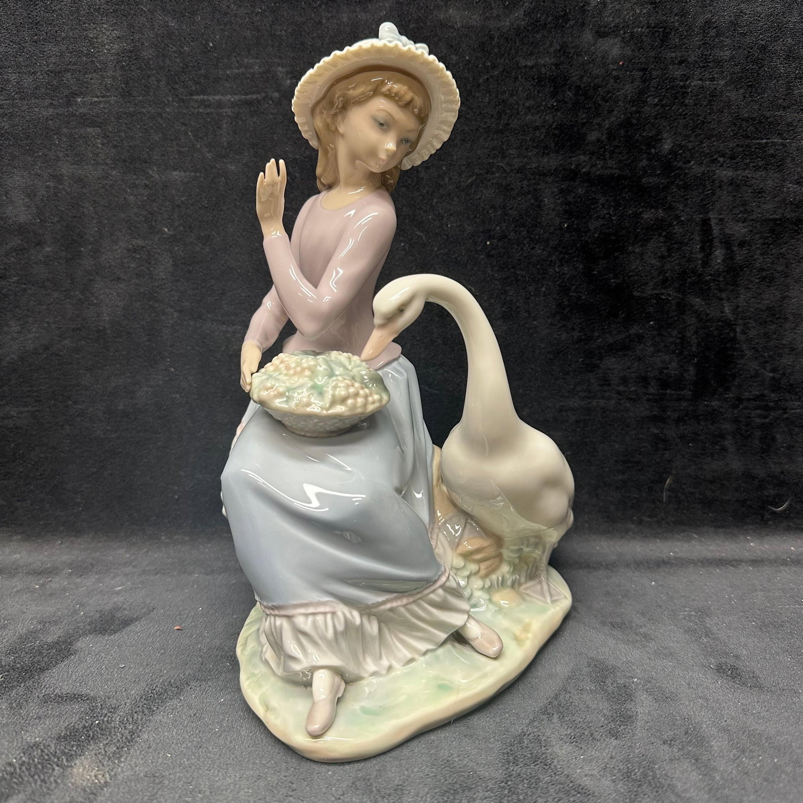 Goose Trying to Eat Lladro Porcelain Figurine: Hallmark of the bottom of the figure, handmade in Spain. No chips, breaks, or noticeable imperfections were noticed. Light markings under the bottom of the figure. This item is in pre-owned,